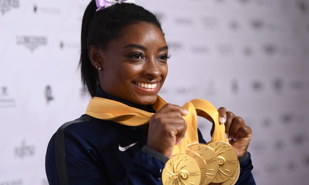 U.S. gymnast Simone Biles poses with her five gold medals at the 2019 World Championships in Stuttgart, Germany. With her wins, she becomes the most decorated gymnast ever at the world championships, with 25 total medals.